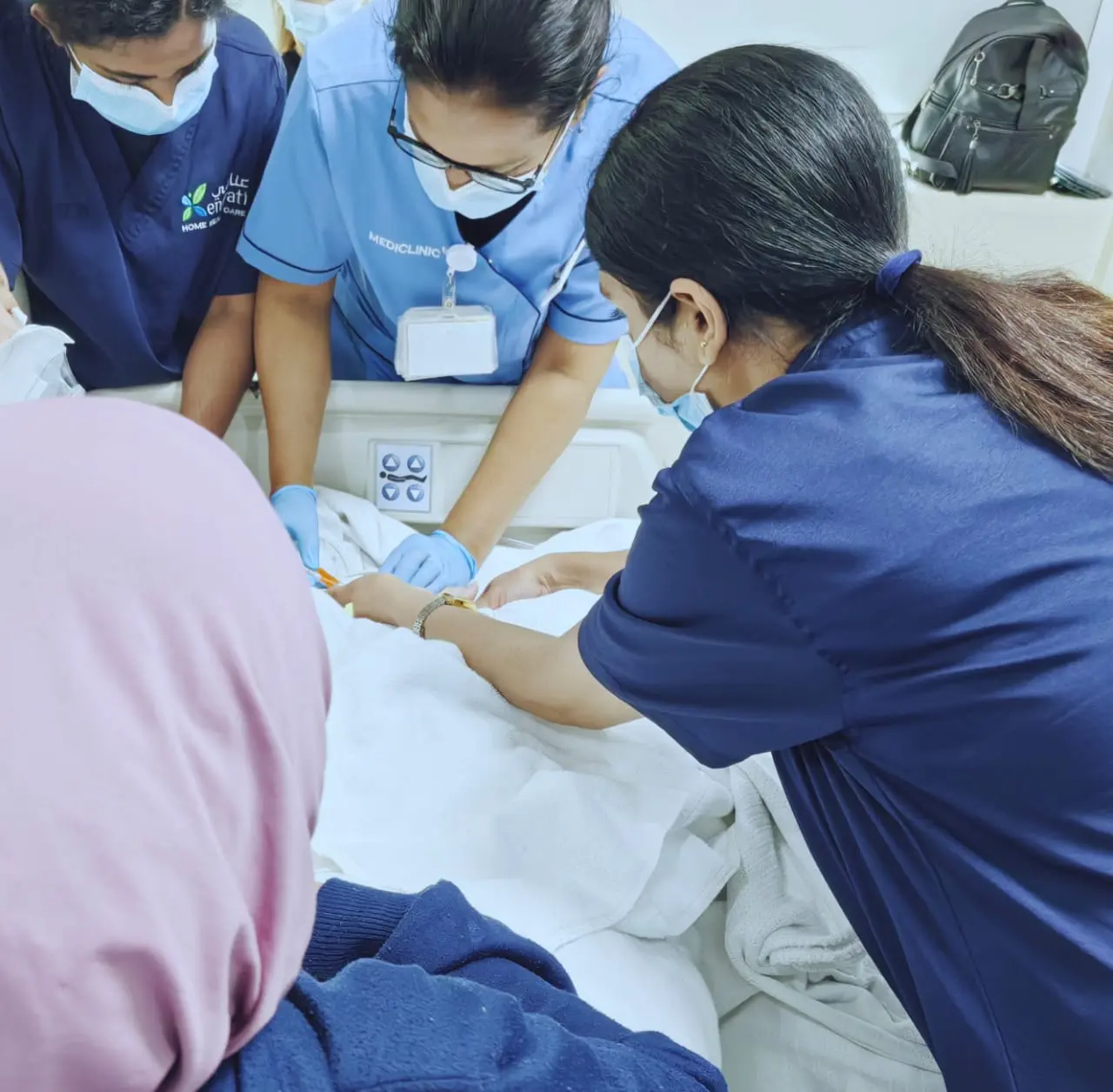 Enayati nurse caring for a patient in hospital